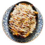 Patatas Durban & cheese fries con salsa ranchera, queso fundido y bacon crujiente.